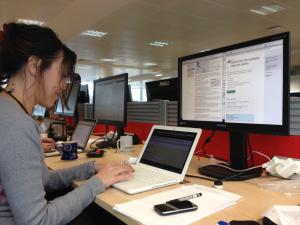 A content designer sitting at her computer