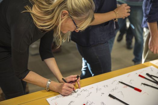 GDS staff signing a 1st birthday card