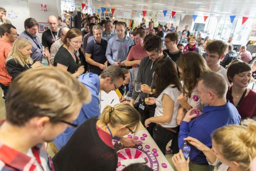 Lots of GDS staff signing a first birthday card