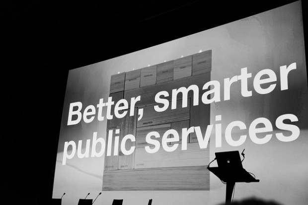 Big screen at a Sprint event reading 'Better, smarter public services"