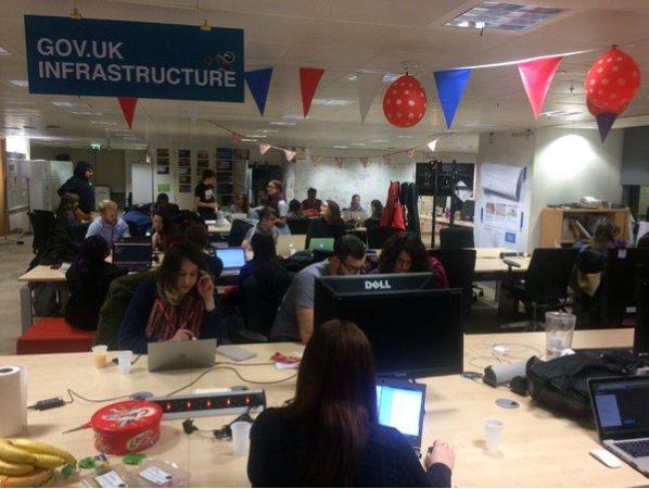 Photo of students and coaches of Codebar working at the GDS offices in Aviation House, Holborn.