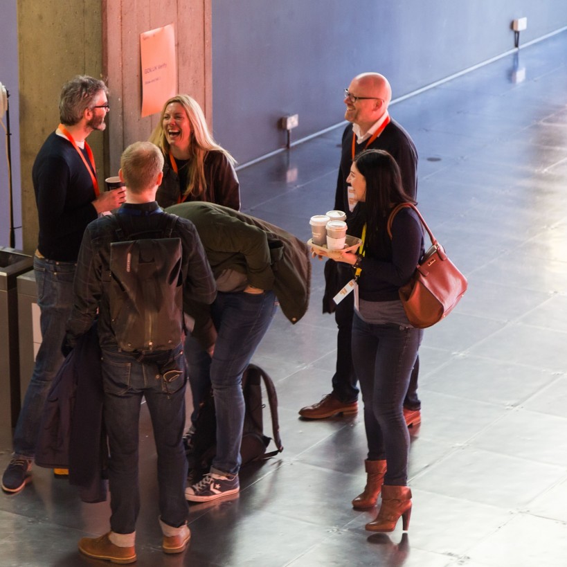 People chatting with coffee at Sprint 16 event