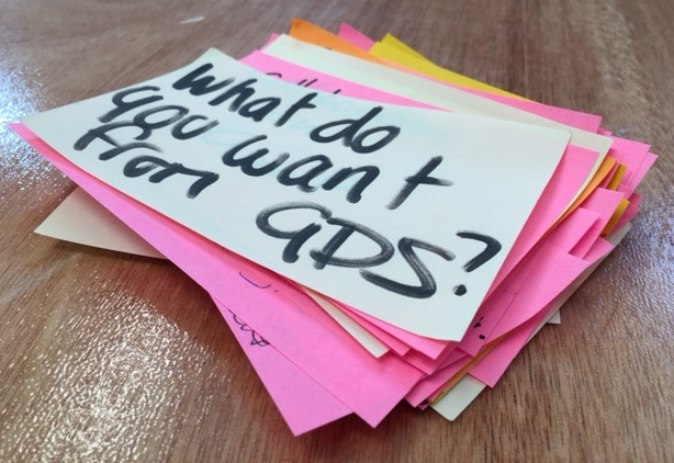 Pile of sticky notes - top one reads "what do you want from GDS?"