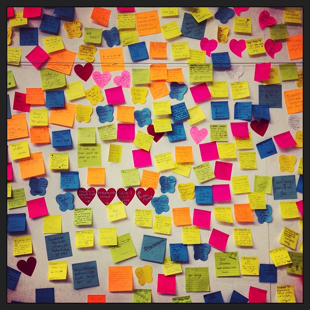 lots of post it notes on a wall