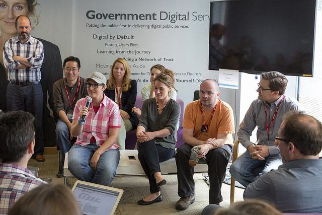 Members of the US Digital Service and 18F teams talking to GDS.