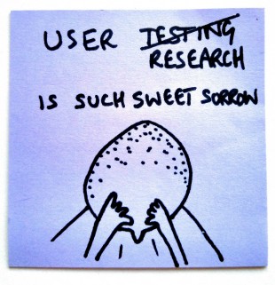 Post-it note with another of Paul Downey’s cartoons that says: “User research is such sweet sorrow.” with a drawing of a person with their head in their hands.