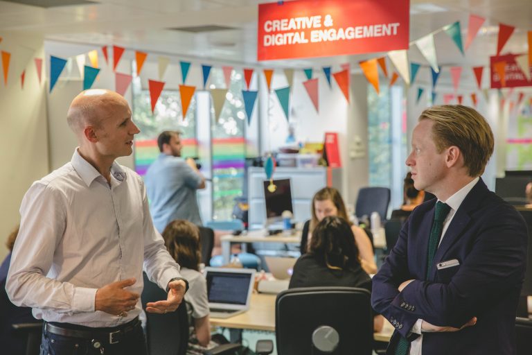 Photo of Minister for the Cabinet Office Ben Gummer talking to Ashley Stephens, Programme Director for Government as a Platform, in the GDS office.