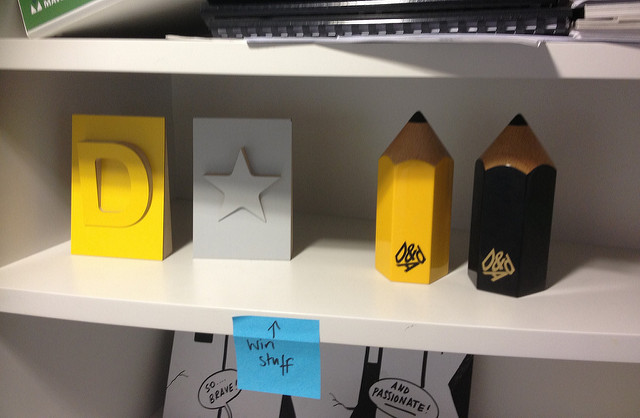 Photo of a shelf in the GDS office with four international awards on the shelf, including a Black Pencil.