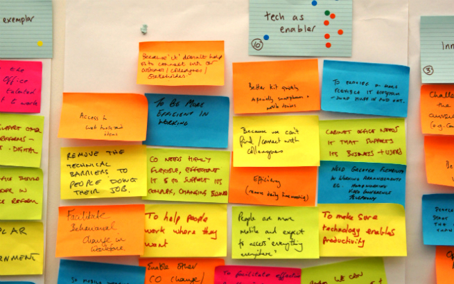 Sticky notes on a wall at the start of the Cabinet Office Technology Transformation project. A prominent note at the top says “tech as enabler”.