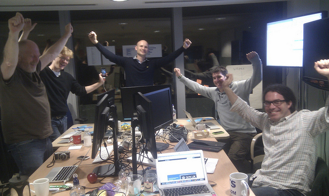 5 GDS developers celebrate the activation of redirects from Directgov and Business Link to GOV.UK, in the early hours of the morning on 17th October 2012