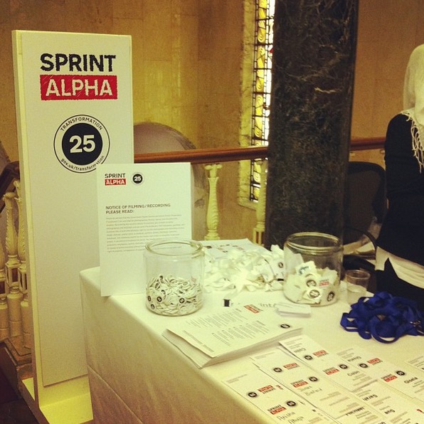 A photo of the welcome stand at the Sprint Alpha event.