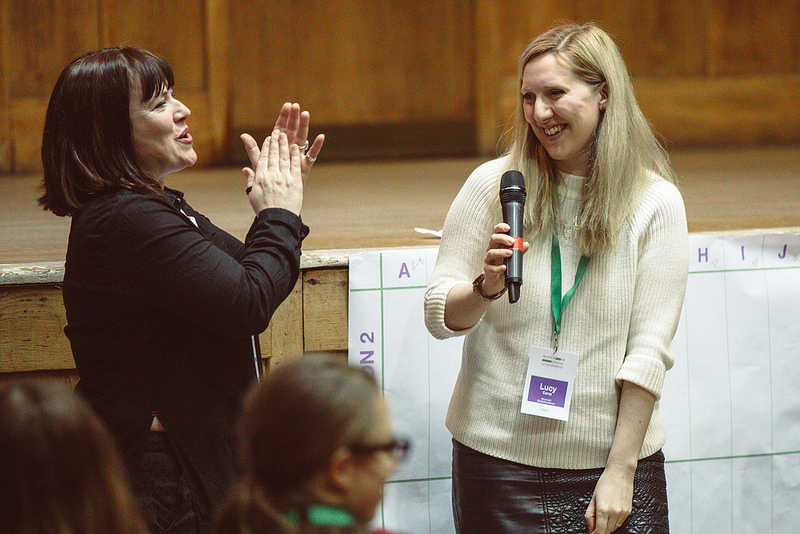 two speakers delivering a talk