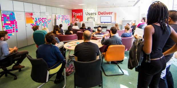 GDS staff sitting in a room listening to a talk