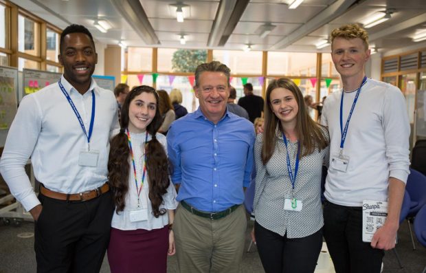 GDS Director General Kevin Cunnington and 4 other people posing for a picture