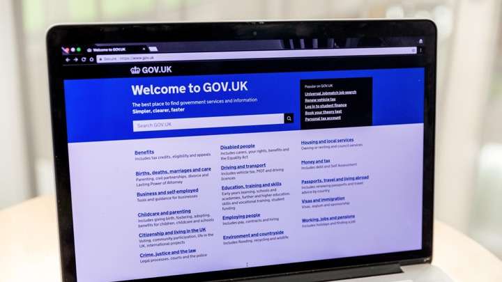 A laptop showing the GOV.UK homepage