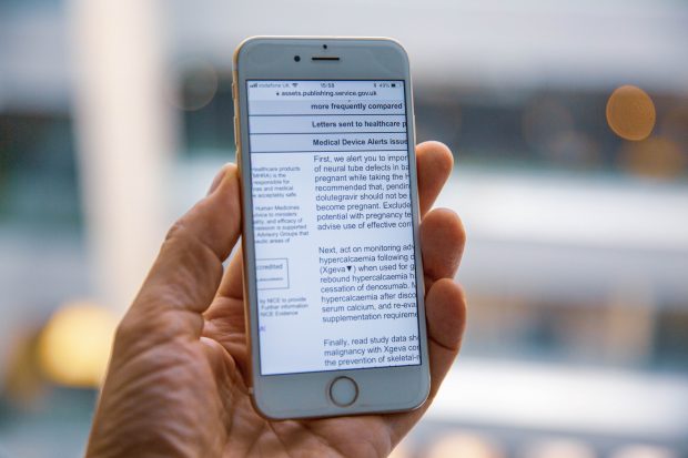 A mobile phone showing a zoomed in part of a PDF