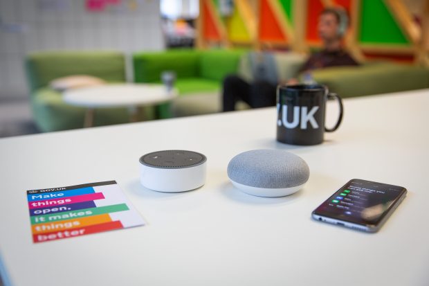 Amazon, Google and Apple voice assistants on a desk
