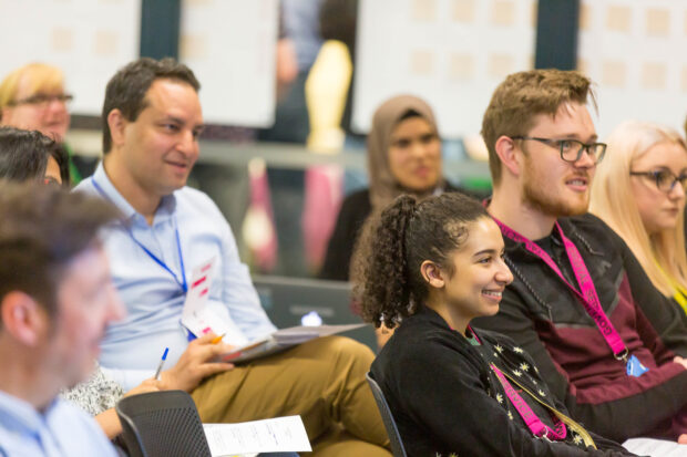 members of GDS staff sitting down and listening to a talk