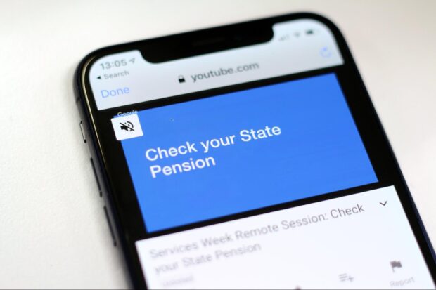 A mobile phone showing a video recording of a service design case study from the Check your State Pension team 