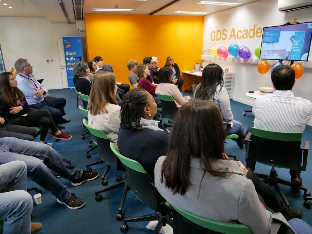 group of people listening to a presenter