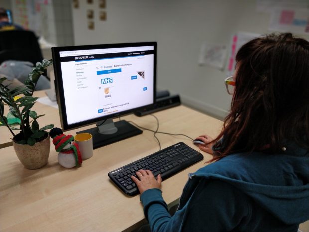 user sitting at a desk using a computer