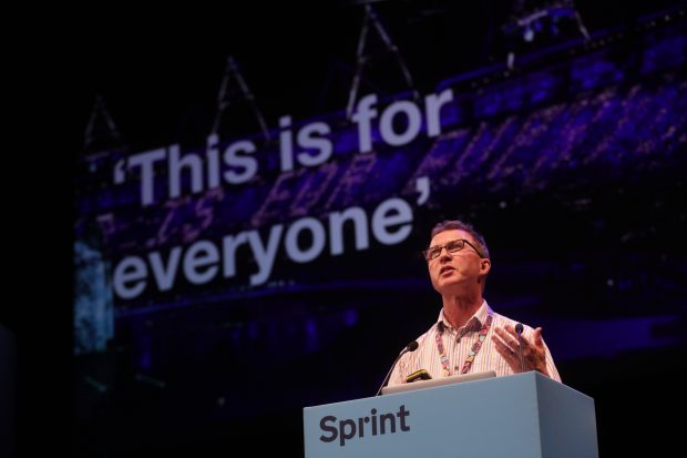 Richard Morton speaking at Sprint with a background showing “This is for everyone”