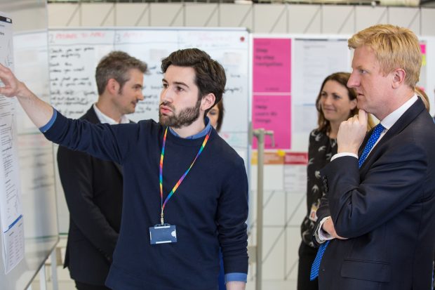 A GDS staff member explaining something to our Minister, Oliver Dowden.