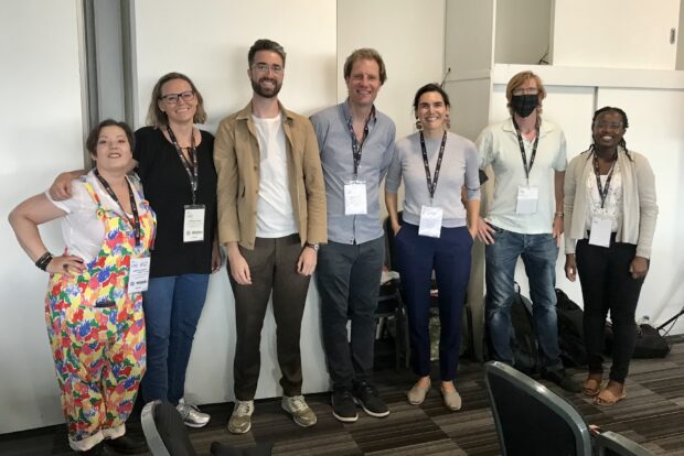 The Forms team is lined up in a row in a conference room at Civil Service Live.